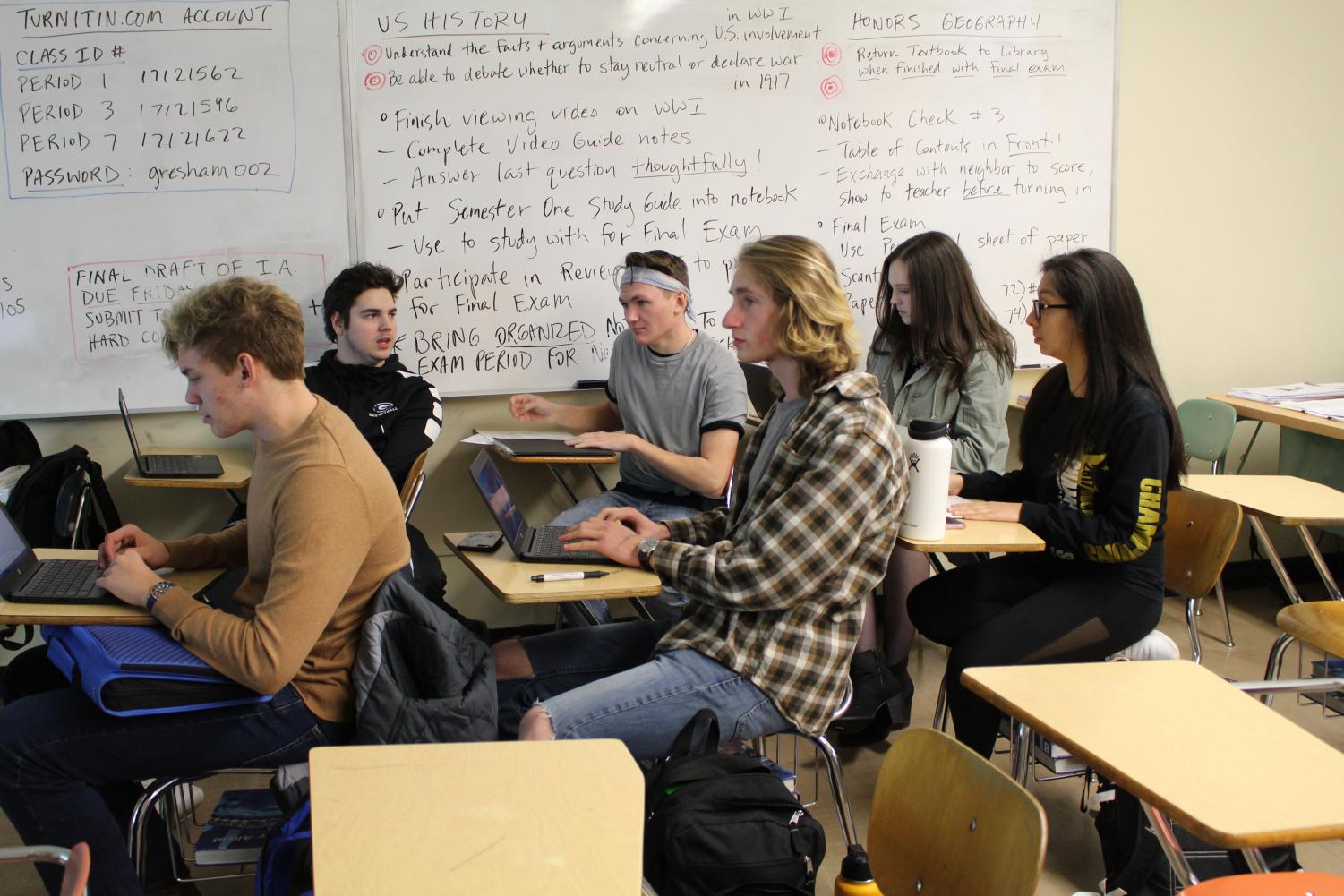A group of seniors in Bart Walker’s seventh period IB World History HL2 class submit their Internal Assessments for grading. Walker’s seventh period class is approximately 11/14, or 78.6% white.