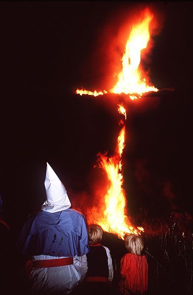 Jazz musician, Daryl Davis, with a member of the Ku Klux Klan at a rally.