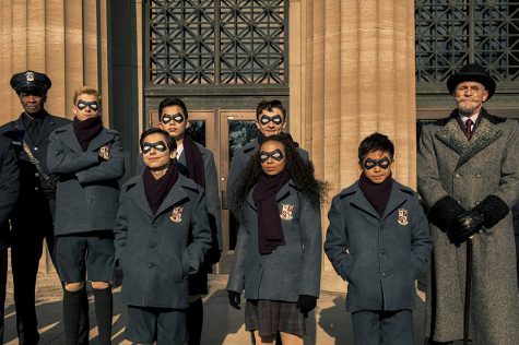 The Umbrella Academy students in front of a bank.