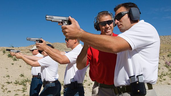 NRA (National Rifles Association) firearm instructor teaching gun safety.